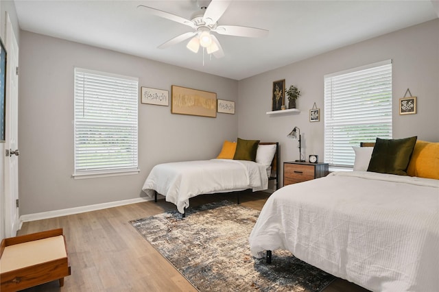 bedroom featuring ceiling fan and light hardwood / wood-style flooring