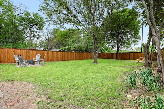 view of yard with an outdoor fire pit