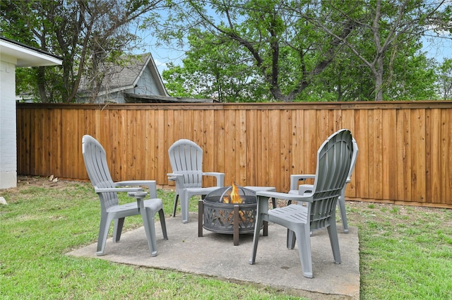 view of patio / terrace featuring an outdoor fire pit