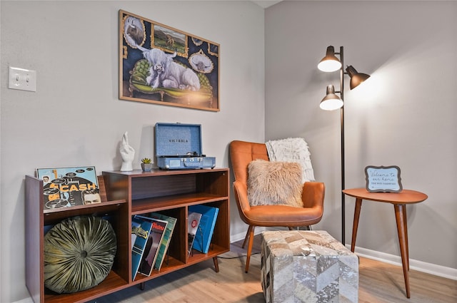 living area with hardwood / wood-style floors