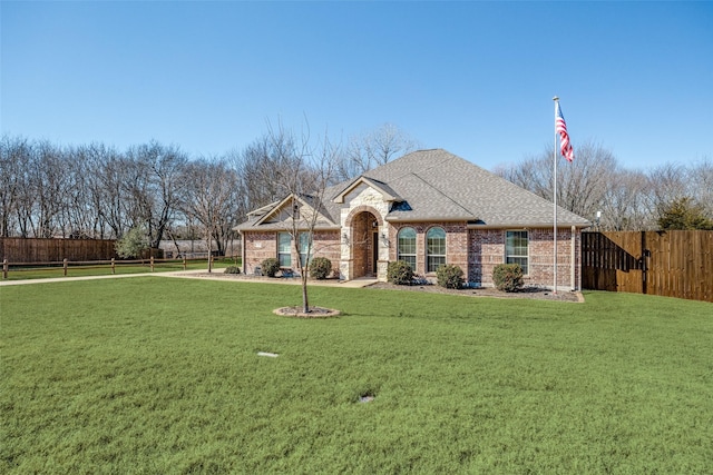 ranch-style house with a front yard