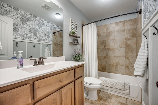 full bathroom featuring shower / tub combo, vanity, a textured ceiling, and toilet