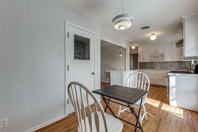 dining space featuring light hardwood / wood-style floors