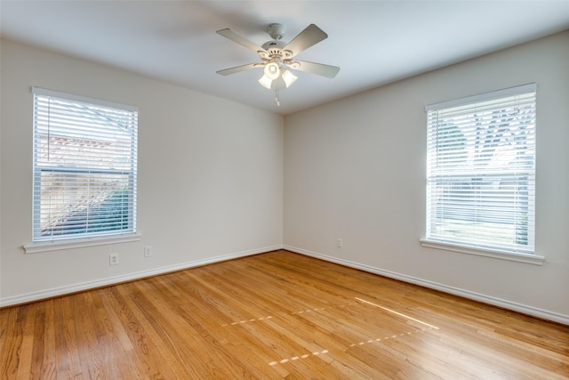 unfurnished room with ceiling fan and light hardwood / wood-style flooring