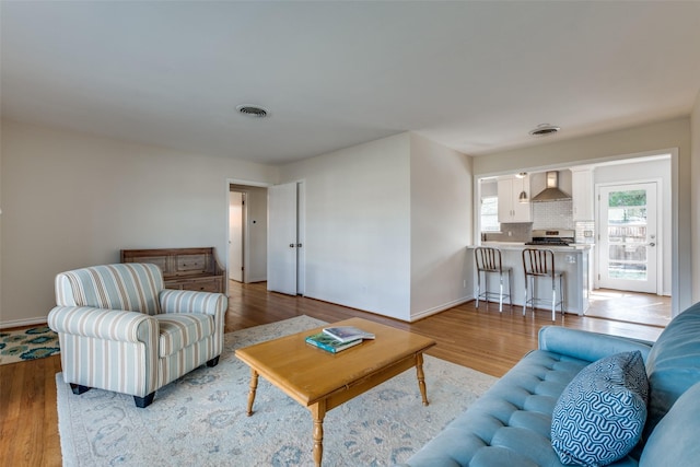 living room with light hardwood / wood-style floors