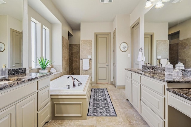 bathroom featuring a bath and vanity