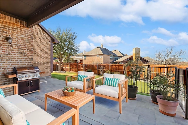 view of patio featuring an outdoor hangout area and a grill