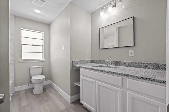 full bathroom featuring shower / bathing tub combination, wood-type flooring, vanity, and toilet