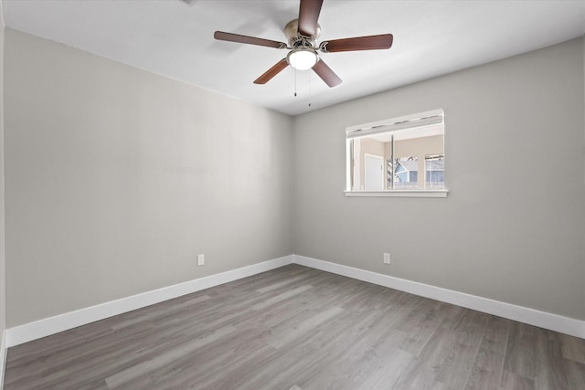 spare room featuring ceiling fan and wood-type flooring