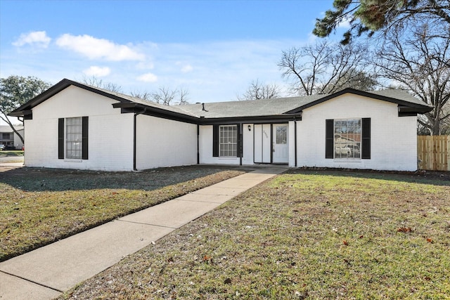 ranch-style home with a front yard