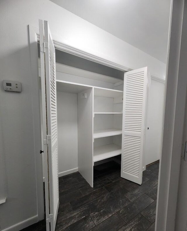 bathroom with wood-type flooring, vanity, and shower / bath combo with shower curtain