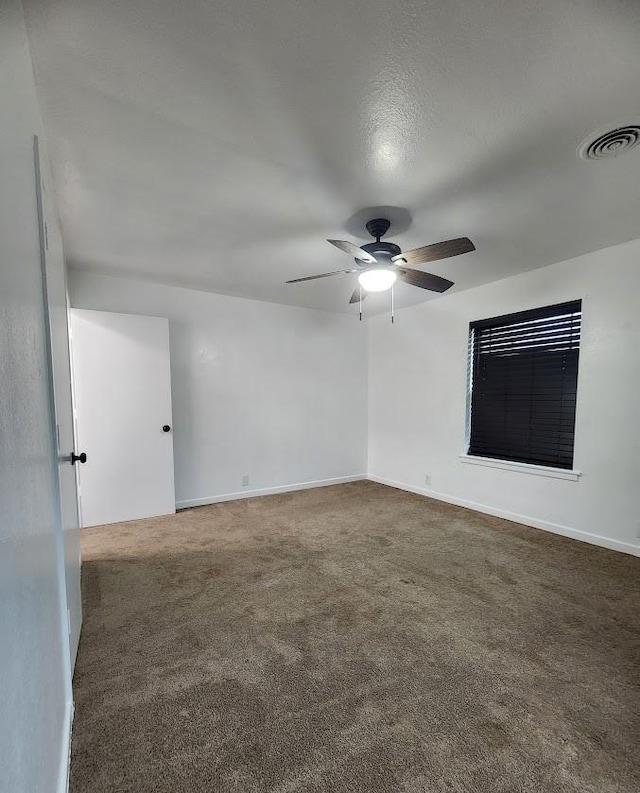 1911 College St, Gainesville, TX 76240 - empty room featuring a ceiling fan, carpet, and baseboards