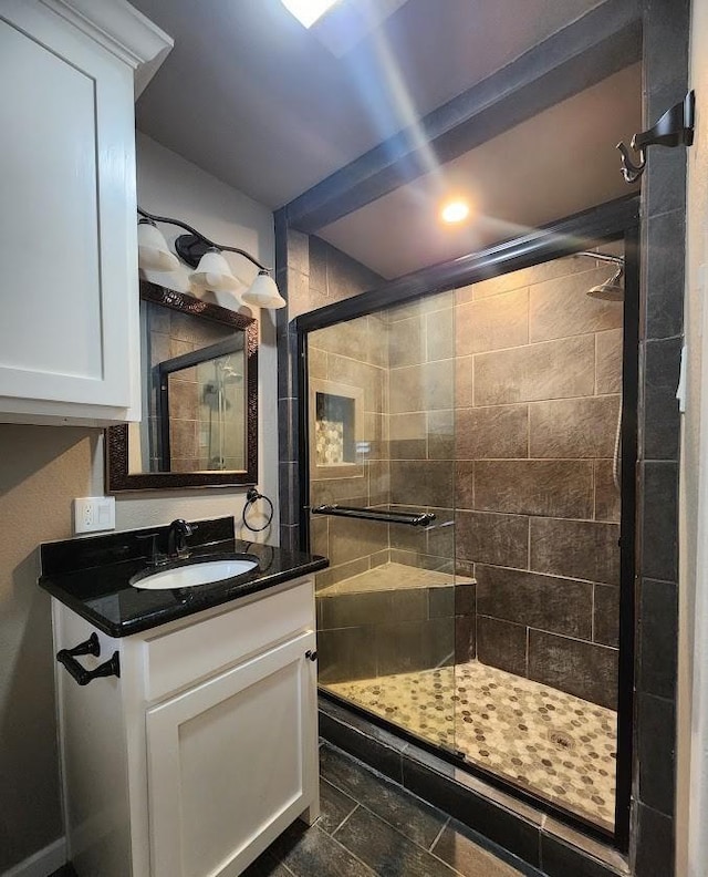 1911 College St, Gainesville, TX 76240 - bathroom with a stall shower, vanity, and recessed lighting