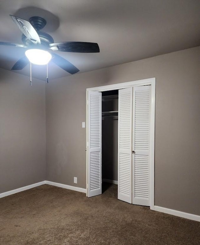 1911 College St, Gainesville, TX 76240 - unfurnished bedroom with dark colored carpet, a closet, baseboards, and ceiling fan