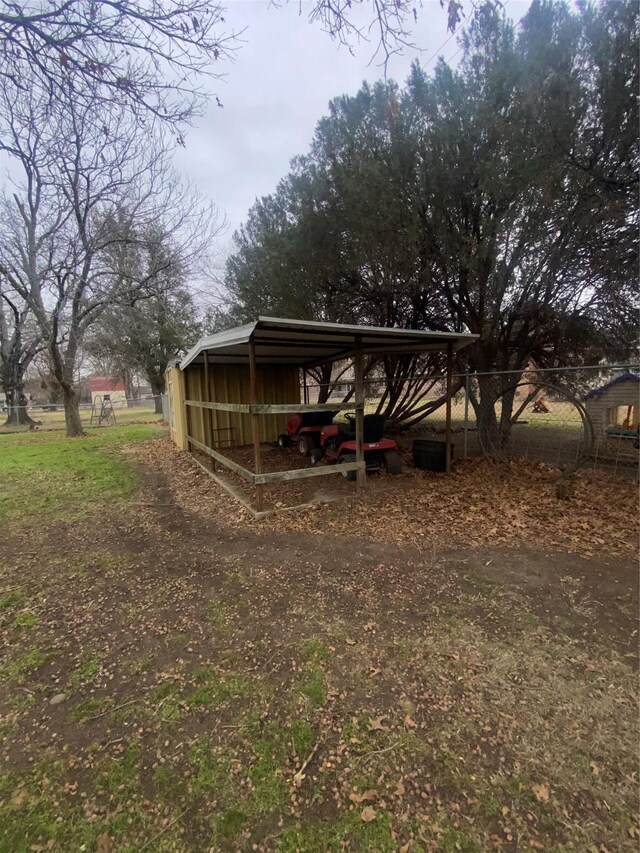 back of property featuring a sunroom and a lawn