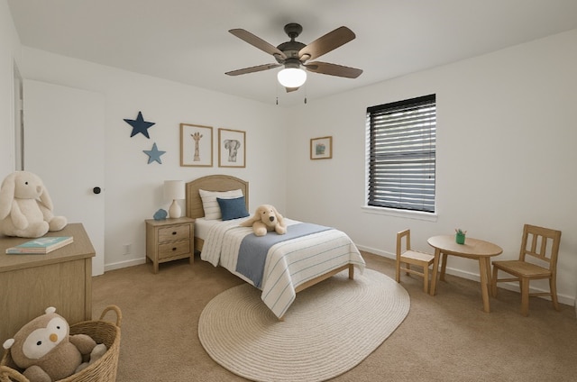 1911 College St, Gainesville, TX 76240 - bedroom featuring light carpet, baseboards, and ceiling fan