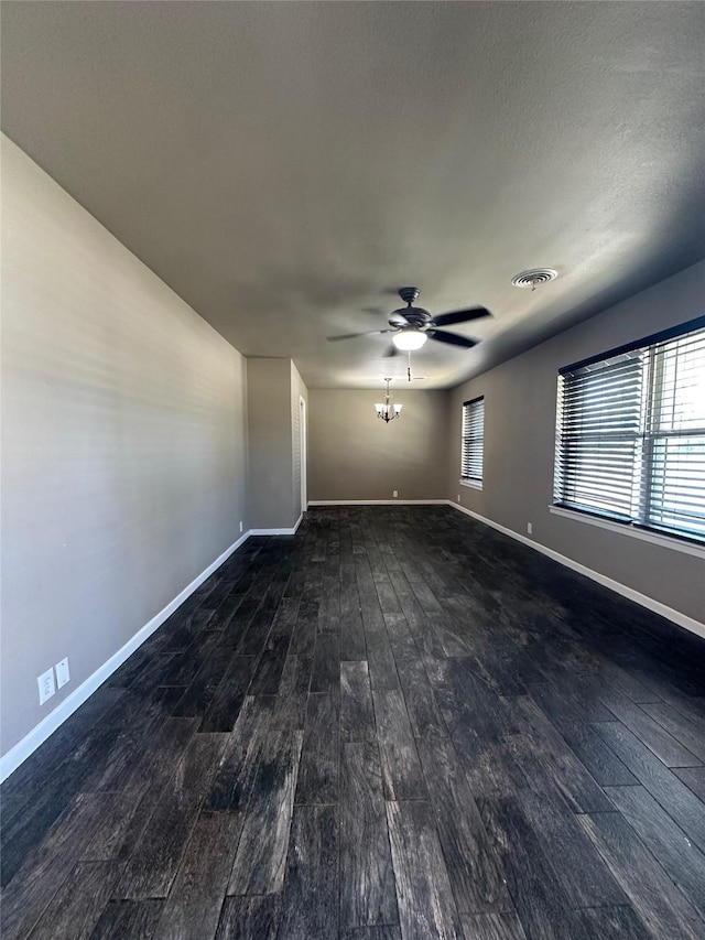 1911 College St, Gainesville, TX 76240 - empty room featuring wood finished floors, a ceiling fan, and baseboards