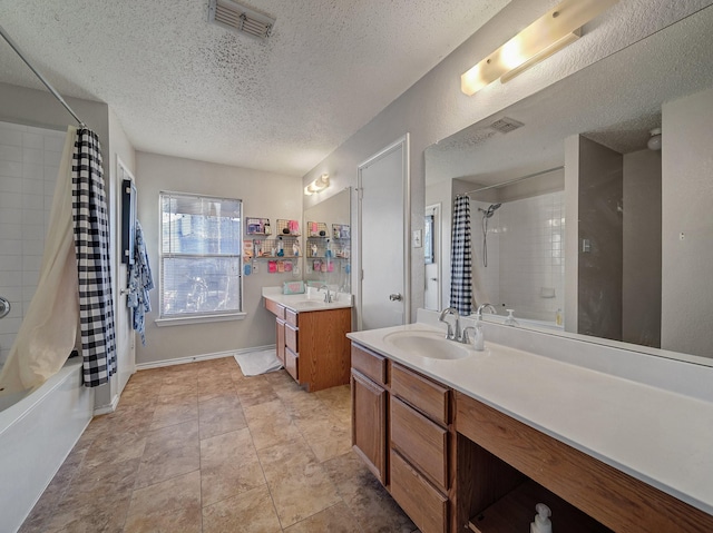 bathroom with vanity, a textured ceiling, and shower / bathtub combination with curtain