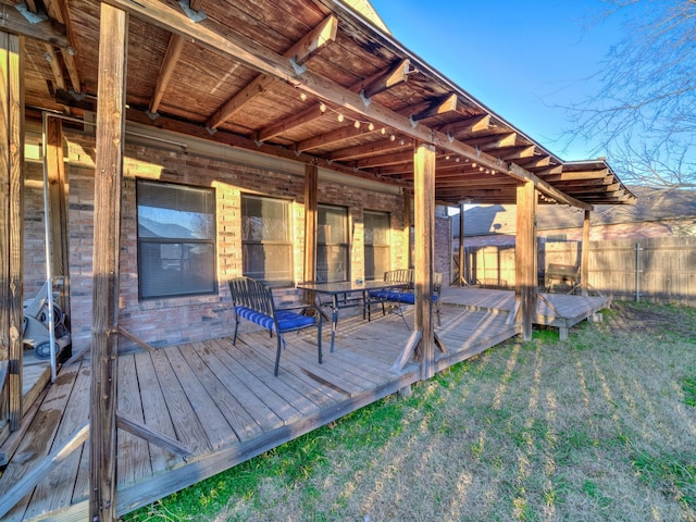 wooden deck with a yard