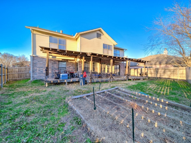 back of property with a wooden deck and a lawn