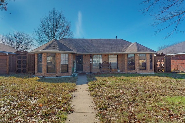 single story home with a front yard