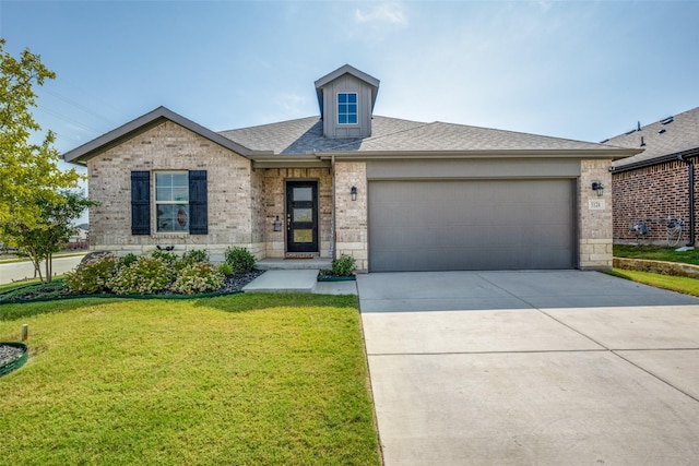 view of front of home featuring a garage and a front yard