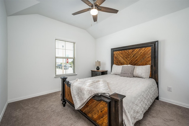 carpeted bedroom with ceiling fan and vaulted ceiling