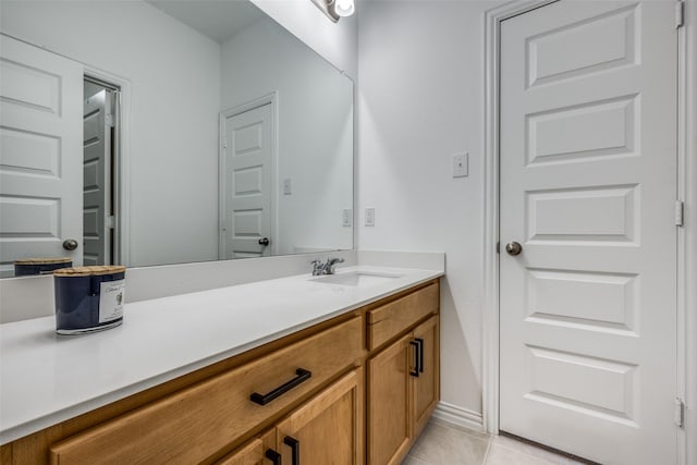 bathroom with tile patterned flooring and vanity