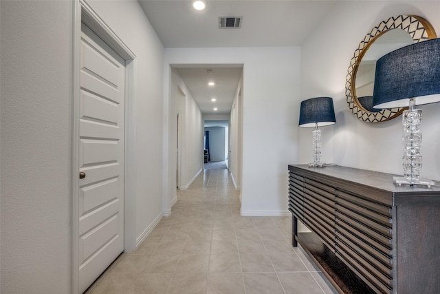 hallway featuring light tile patterned floors