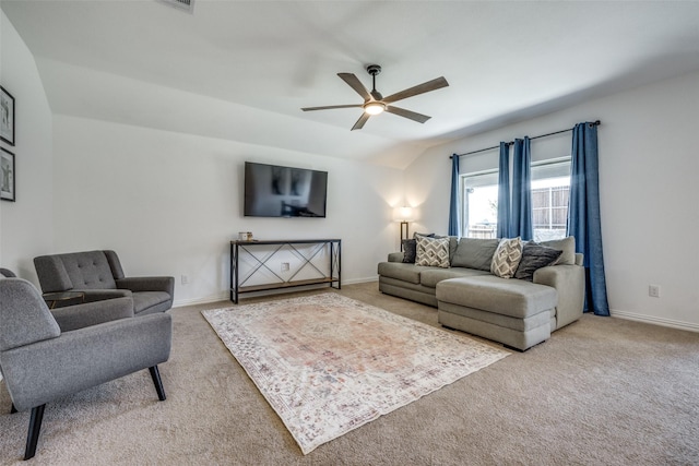 carpeted living room featuring ceiling fan and lofted ceiling