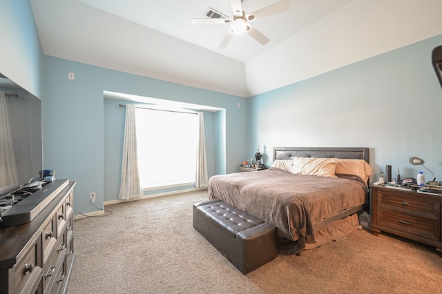 bedroom featuring ceiling fan, light colored carpet, and vaulted ceiling