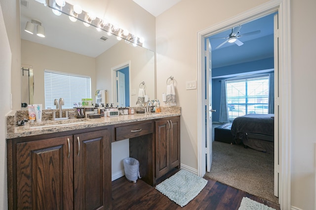 bathroom featuring hardwood / wood-style flooring, vanity, and ceiling fan