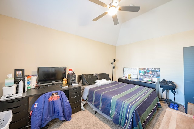 carpeted bedroom featuring ceiling fan and vaulted ceiling