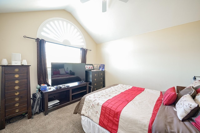 carpeted bedroom featuring ceiling fan and vaulted ceiling