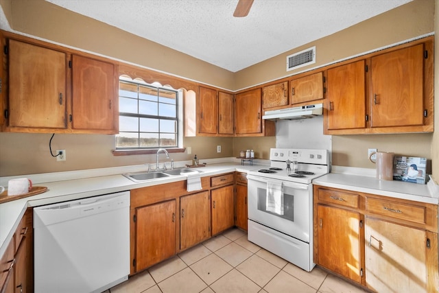 kitchen featuring sink, a textured ceiling, white appliances, light tile patterned flooring, and ceiling fan