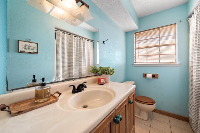 bathroom featuring toilet, tile patterned flooring, vanity, and a textured ceiling