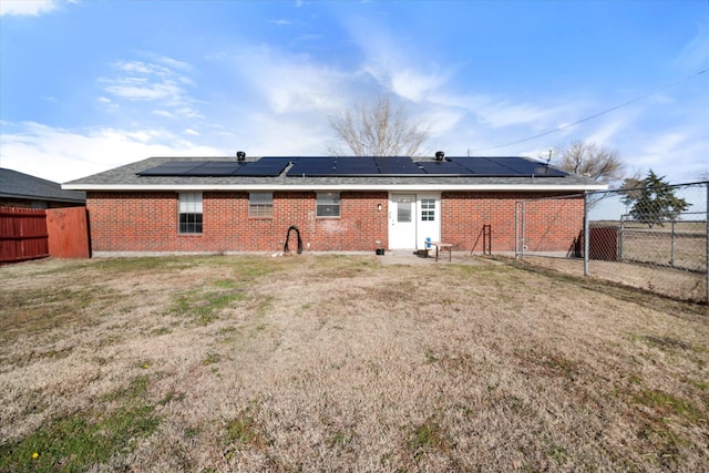 back of house with a yard