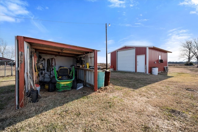 view of outdoor structure featuring a lawn and a garage