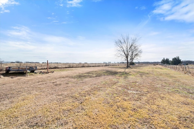 view of yard with a rural view