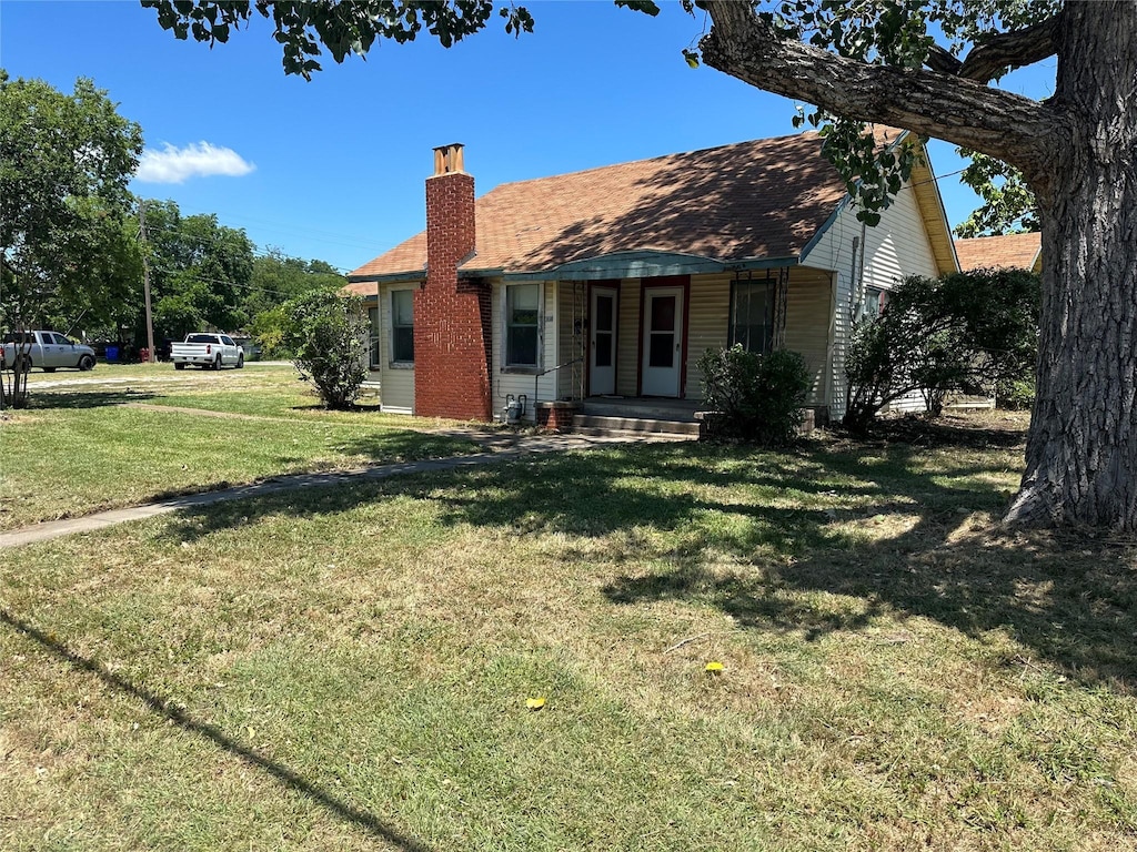 exterior space with a yard