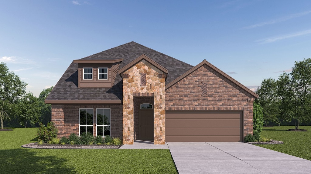 view of front of home with a front yard and a garage