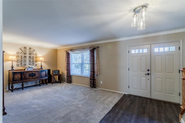 entrance foyer with hardwood / wood-style floors and crown molding