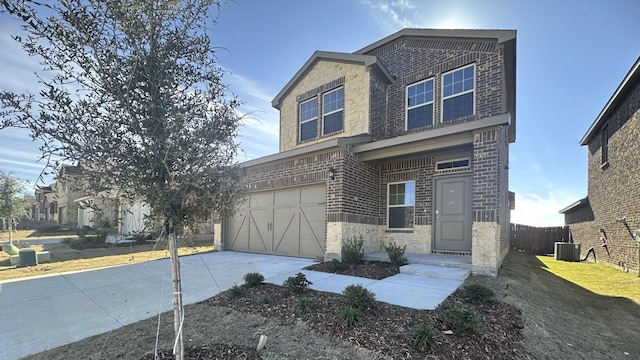 view of front of home with a garage and cooling unit