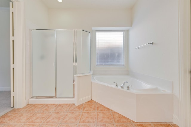 bathroom with tile patterned flooring and independent shower and bath