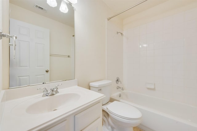 full bathroom with bathing tub / shower combination, vanity, and toilet