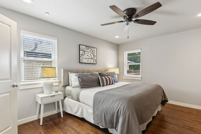 bedroom featuring dark wood-type flooring and ceiling fan