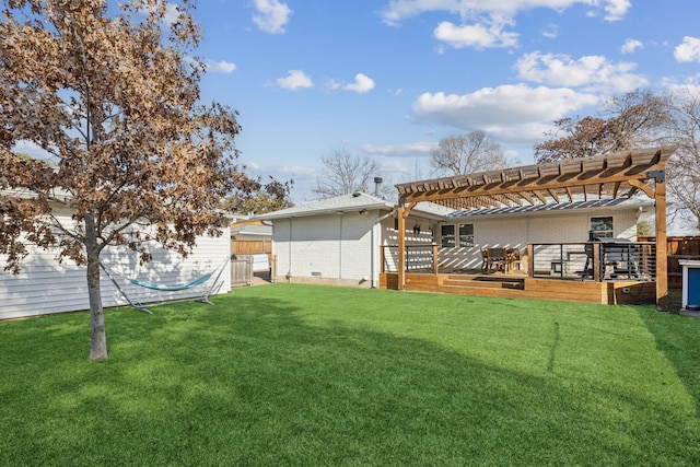 view of yard featuring a deck and a pergola