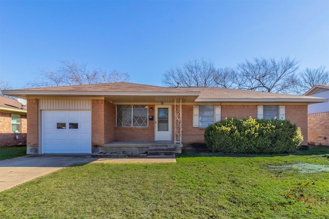 ranch-style home with a front yard and a garage