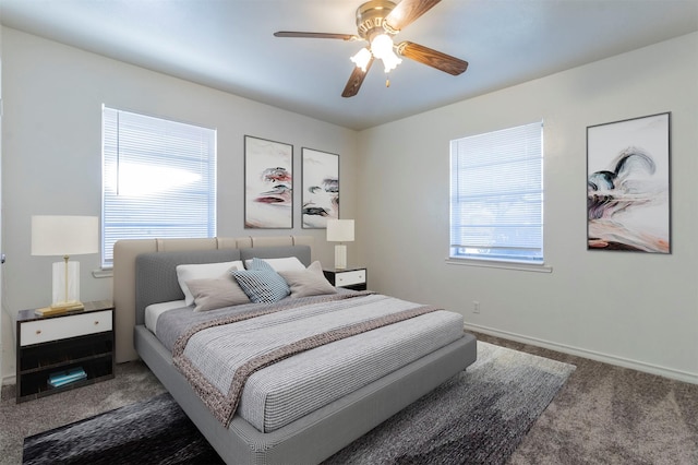 bedroom with ceiling fan and dark carpet