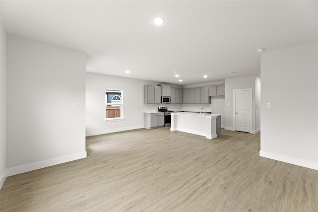 6721 Golden Grove Rd, Fort Worth, TX 76123 - kitchen with gray cabinetry, appliances with stainless steel finishes, baseboards, recessed lighting, and light countertops